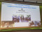 Gro&szlig;aufnahme einer Pr&auml;sentationsfolie mit dem Titel &bdquo;Four Decades in Dialogue &ndash; Insights on sustainable human-nature relations&ldquo; von Marion Glaser, erg&auml;nzt durch Fotos verschiedener Gespr&auml;chsrunden.